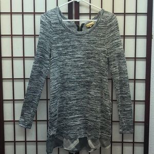 Grey, long sleeved with ruffles and zipper in back